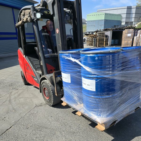 Forklift loading a pallet of esterquat fabric softener concentrate drums — Nova Plus