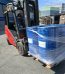 Forklift loading a pallet of esterquat fabric softener concentrate drums — Nova Plus