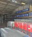 Warehouse racking with drums and IBC totes of SLES 70% ready for export — Nova Plus