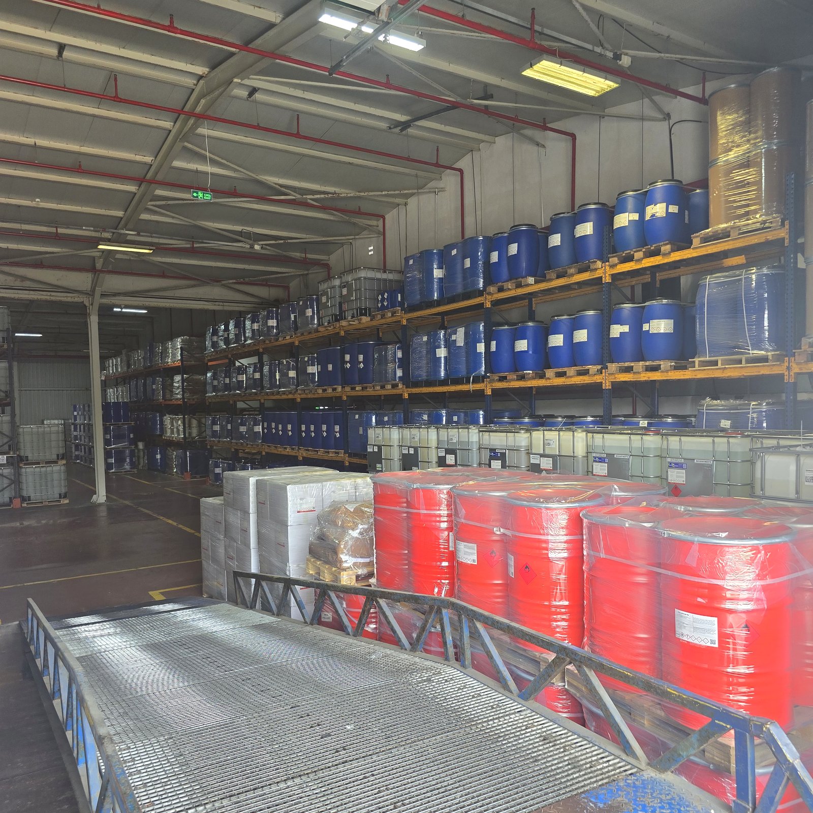 nova-sles-70-texapon-sodium-lauryl-ether-sulphate-01 Warehouse racking with drums and IBC totes of SLES 70% ready for export — Nova Plus